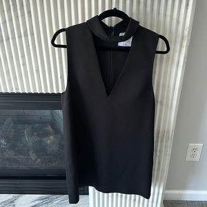 Size M c/meo collective black shift dress with high neck and low front. Size M.